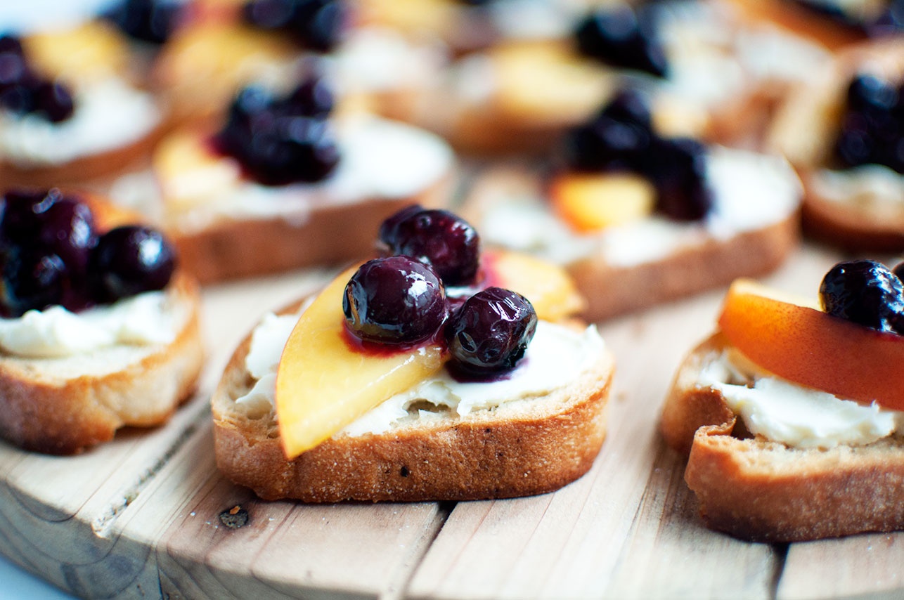 Peach Crostini with Roasted Blueberries - Pretty in Pistachio